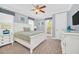 Main bedroom with a king-size bed and white furniture at 8162 Valhalla Ter, Reunion, FL 34747