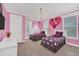 Charming bedroom with Minnie Mouse theme and two twin beds at 8162 Valhalla Ter, Reunion, FL 34747