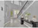 Spacious entryway with double doors and a console table at 8162 Valhalla Ter, Reunion, FL 34747