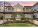 Two-story house with stone accents, two-car garage, and landscaped yard at 8162 Valhalla Ter, Reunion, FL 34747