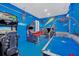 Game room with air hockey, arcade games, and a fun theme at 8162 Valhalla Ter, Reunion, FL 34747