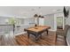 Game room with pool table and hardwood floors at 8162 Valhalla Ter, Reunion, FL 34747