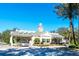 Community gated entrance with guardhouse and landscaping at 8162 Valhalla Ter, Reunion, FL 34747