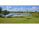 Expansive golf course with lake and walking bridge at 8162 Valhalla Ter, Reunion, FL 34747