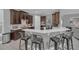 Modern kitchen with dark wood cabinets and breakfast bar at 8162 Valhalla Ter, Reunion, FL 34747