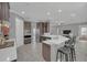 Well-equipped kitchen with dark cabinetry and island at 8162 Valhalla Ter, Reunion, FL 34747