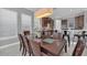 Spacious kitchen boasts dark wood cabinetry, stainless steel appliances, and a breakfast bar at 8162 Valhalla Ter, Reunion, FL 34747