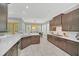 Modern kitchen with dark cabinets and an island at 8162 Valhalla Ter, Reunion, FL 34747