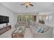 Bright living room featuring comfortable seating and a view of the pool at 8162 Valhalla Ter, Reunion, FL 34747