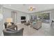 Comfortable living room with access to a screened-in patio at 8162 Valhalla Ter, Reunion, FL 34747