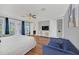 Bright main bedroom with a king-size bed, hardwood floors, and access to en-suite bathroom at 8162 Valhalla Ter, Reunion, FL 34747