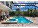 Enclosed pool and spa with basketball hoop at 8162 Valhalla Ter, Reunion, FL 34747