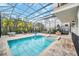 Enclosed pool and spa with lounge chairs at 8162 Valhalla Ter, Reunion, FL 34747