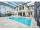 Inviting pool area with spacious patio and screened enclosure at 8162 Valhalla Ter, Reunion, FL 34747