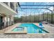 Enclosed pool and spa with patio and fire pit at 8162 Valhalla Ter, Reunion, FL 34747