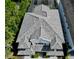 Aerial view of the home's patterned tile roof and impeccable detailing of a luxury residence at 8162 Valhalla Ter, Reunion, FL 34747