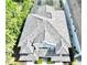 Aerial view of the home's patterned tile roof and impeccable detailing of a luxury residence at 8162 Valhalla Ter, Reunion, FL 34747