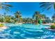 Large community pool with palm trees at 8162 Valhalla Ter, Reunion, FL 34747