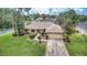 Single-story house with a two-car garage and well-manicured lawn at 26 Lake Diamond Ave, Ocala, FL 34472
