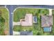 Bird's-eye view showing house, pool, and surrounding neighborhood at 26 Lake Diamond Ave, Ocala, FL 34472