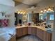 Large bathroom with double sinks and corner bathtub at 26 Lake Diamond Ave, Ocala, FL 34472
