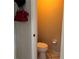 Small half bathroom with toilet and sink at 26 Lake Diamond Ave, Ocala, FL 34472