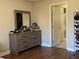 Bedroom with dresser and view of en-suite bath at 26 Lake Diamond Ave, Ocala, FL 34472