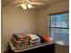 Small bedroom with window and ceiling fan at 26 Lake Diamond Ave, Ocala, FL 34472