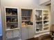 Built-in shelving with display cabinets and storage at 26 Lake Diamond Ave, Ocala, FL 34472