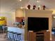 Living area with a breakfast bar and three bar stools at 26 Lake Diamond Ave, Ocala, FL 34472