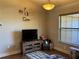 Living room with flat screen TV and built in shelving at 26 Lake Diamond Ave, Ocala, FL 34472
