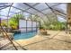 Expansive pool area with fire pit and waterfall feature at 26 Lake Diamond Ave, Ocala, FL 34472