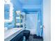Bathroom with blue walls, bathtub, and shower at 103 Las Flores, Winter Haven, FL 33884