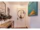 Entryway with console table, artwork and hoop at 103 Las Flores, Winter Haven, FL 33884