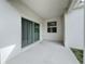 Covered patio with sliding glass door access at 11880 Campfire Story Ln, Orlando, FL 32832