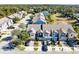 Aerial view of townhouses with attached garages and landscaped yards at 1311 E 10Th St, Apopka, FL 32703