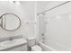 Bathroom features a shower-tub combo, toilet and sink at 1311 E 10Th St, Apopka, FL 32703