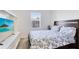 Bedroom with a large bed, built-in shelving, and a window at 1311 E 10Th St, Apopka, FL 32703