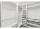 Spacious walk-in closet with ample shelving and drawers for storage and organization at 1311 E 10Th St, Apopka, FL 32703