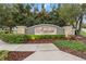 Ambergate community sign surrounded by lush landscaping and manicured greenery on a sunny day at 1311 E 10Th St, Apopka, FL 32703