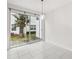 Bright dining area with sliding glass doors leading to a private patio and white tile flooring at 1311 E 10Th St, Apopka, FL 32703