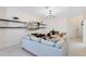 Comfortable living room featuring modern decor, media console, and floating shelves at 1311 E 10Th St, Apopka, FL 32703