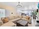 Inviting living room with modern furnishings, adjacent dining area, and an open layout to the kitchen at 1311 E 10Th St, Apopka, FL 32703
