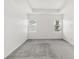 Spacious bedroom with neutral carpet, tray ceiling, and bright windows at 1311 E 10Th St, Apopka, FL 32703