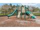 Community playground featuring slides, climbing structures, and a safety surface in a fenced-in area at 1311 E 10Th St, Apopka, FL 32703