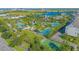 Aerial view of community with pools, sports courts, and green spaces at 13135 Granger Ave, Orlando, FL 32827