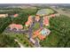 Aerial view of community with resort-style pool, golf course, and multiple buildings at 1361 Tuscan Ter # 7305, Davenport, FL 33896