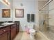 Bathroom with walk-in shower, granite vanity, and tile flooring at 1361 Tuscan Ter # 7305, Davenport, FL 33896