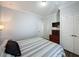 Bedroom with wood flooring and a striped comforter at 1361 Tuscan Ter # 7305, Davenport, FL 33896
