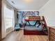 Bedroom with a bunk bed, large mural, and window with blinds at 1361 Tuscan Ter # 7305, Davenport, FL 33896